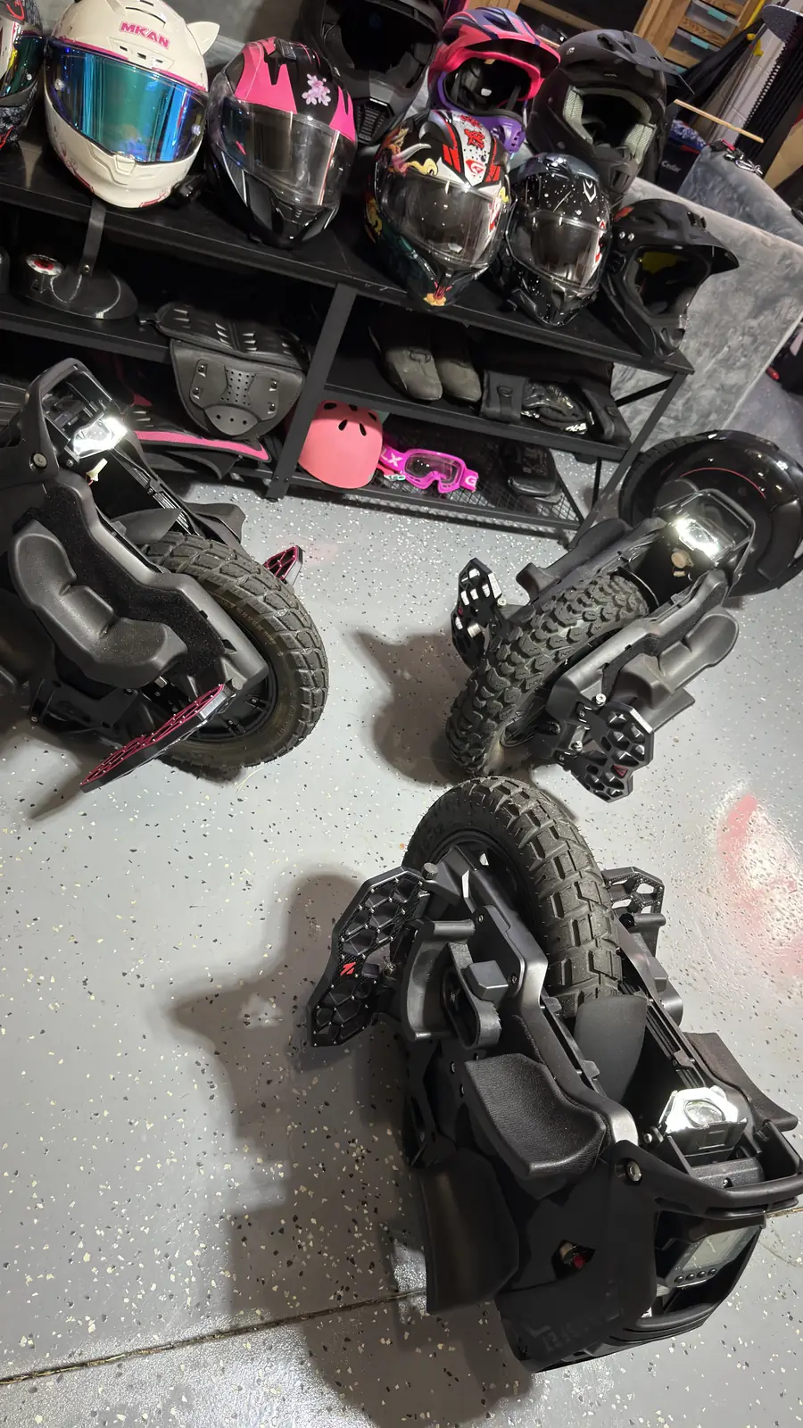 Helmets on the shelf above a row of wheels at EUC Dojo