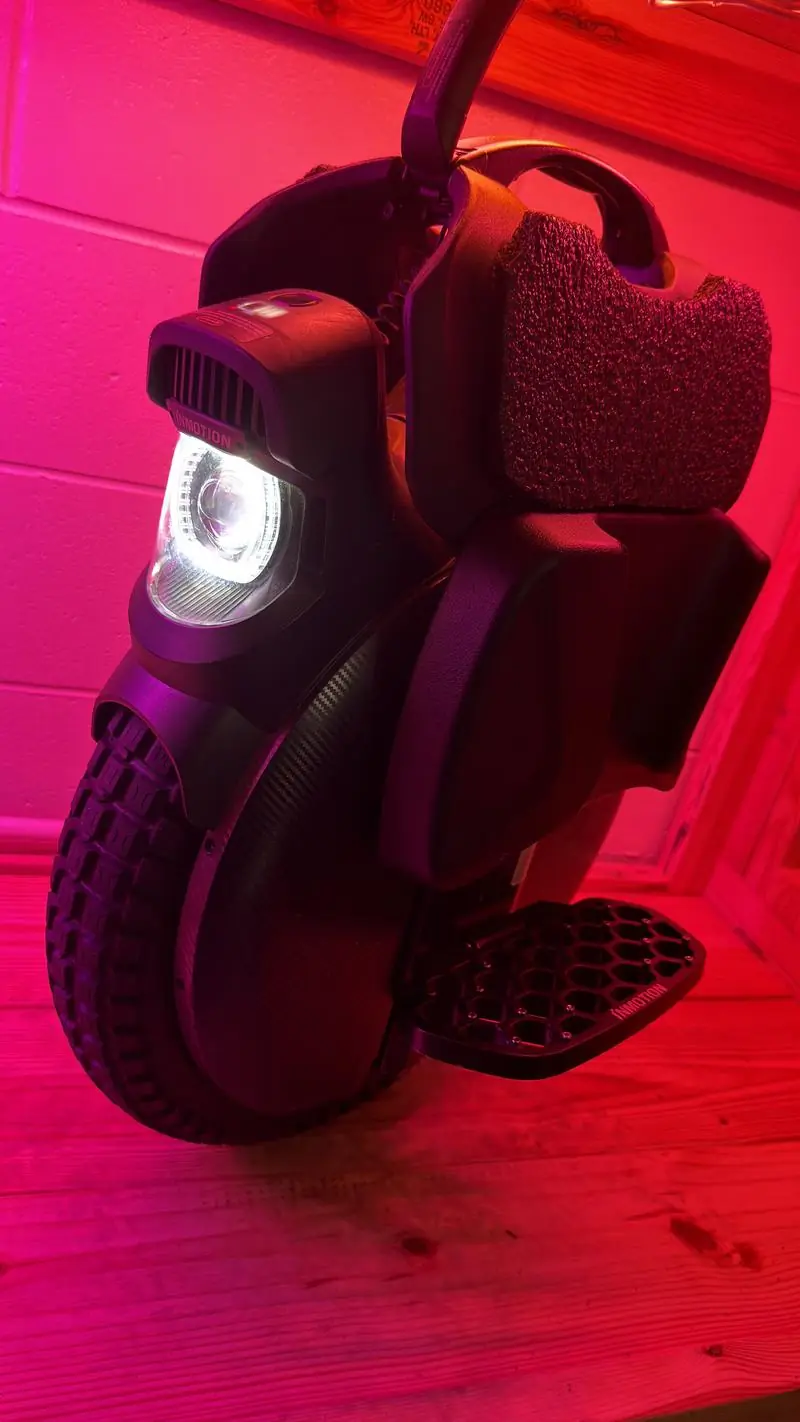 An electric unicycle lit in red